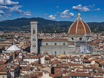 The Santa Maria del Fiore Duomo and the Giotto Bell Tower seen from the Palazzo Vecchio tower in Florence in Italy